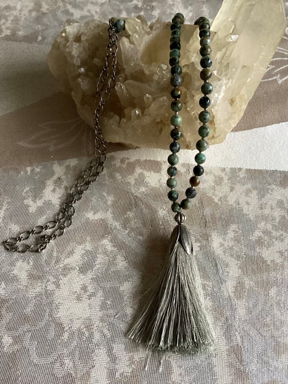 Green beaded necklace with tassel, 30 inches